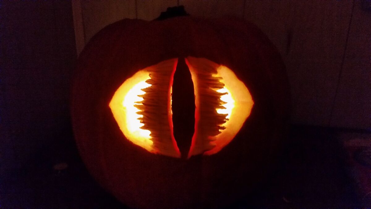 A pumpkin carved with the Eye of Sauron from The Lord of the Rings.