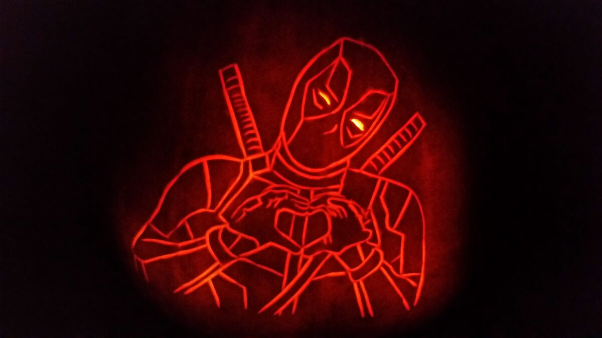A pumpkin carved with Marvel's Deadpool.