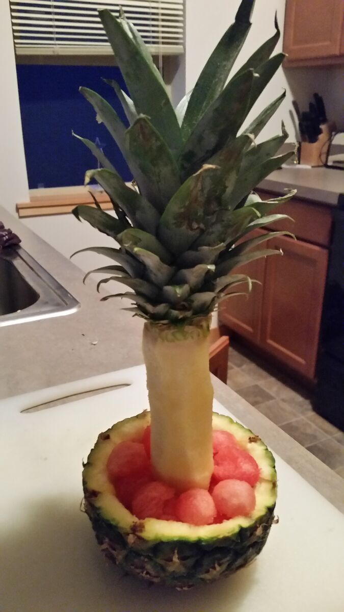 A watermelon carved with a pineapple.