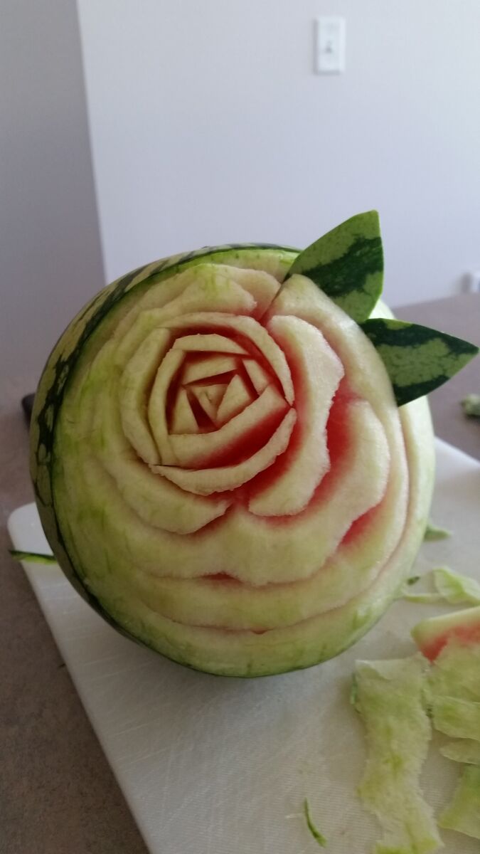 A watermelon carved with a rose.