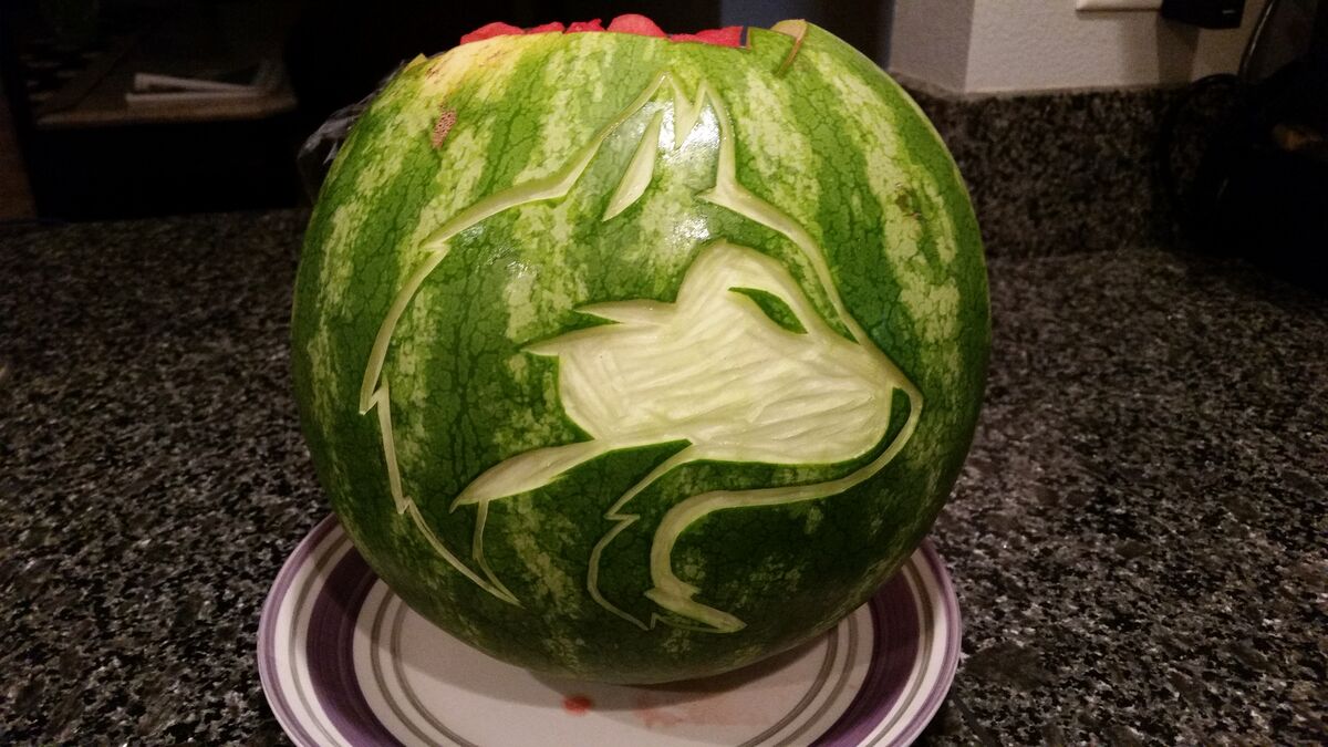 A watermelon carved with the UW Husky logo.