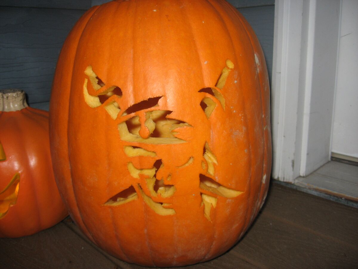 A pumpkin carved with a pirate skull.