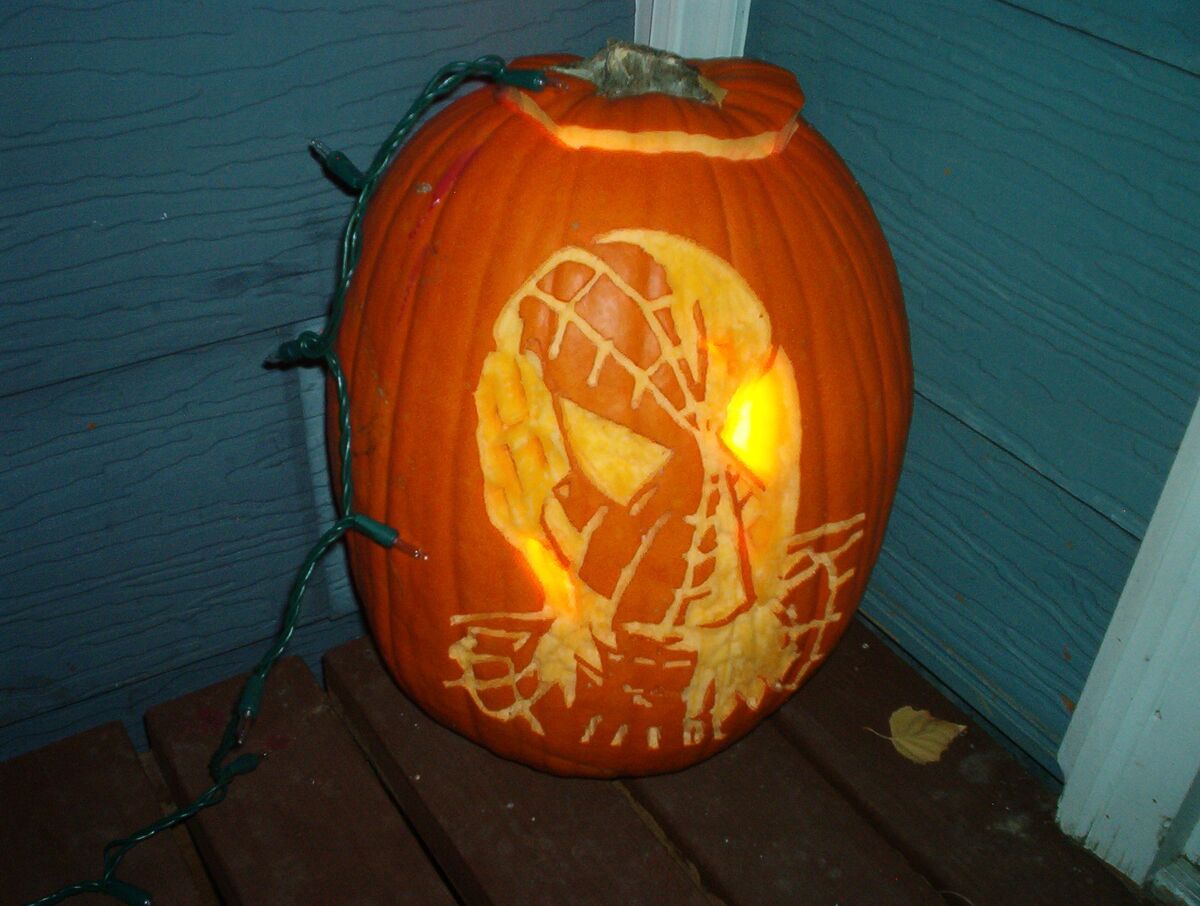 A pumpkin carved with Marvel's Spider-Man.