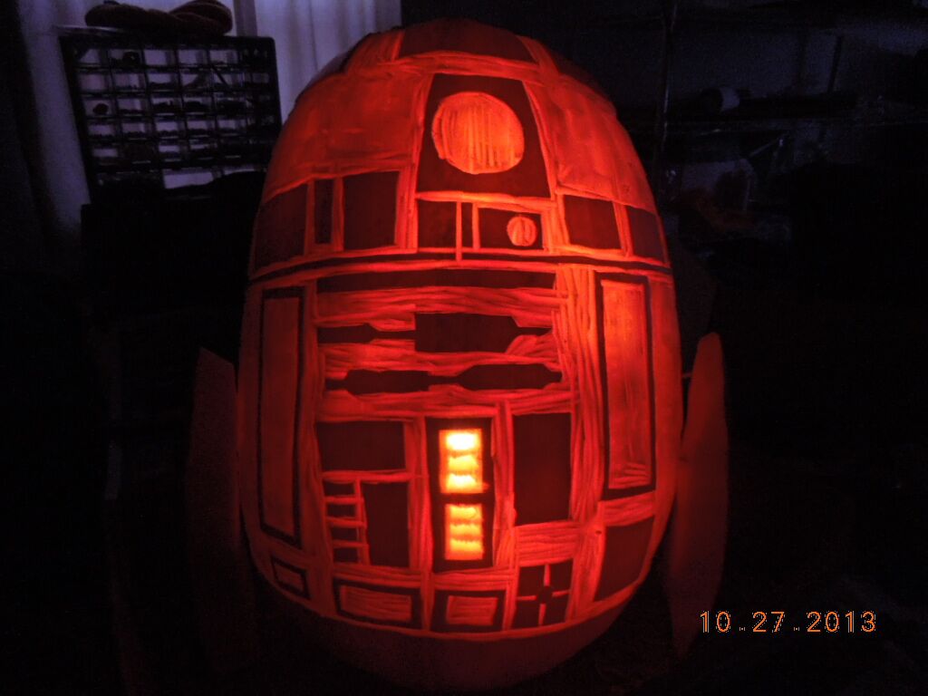 A pumpkin carved with R2-D2 from Star Wars.