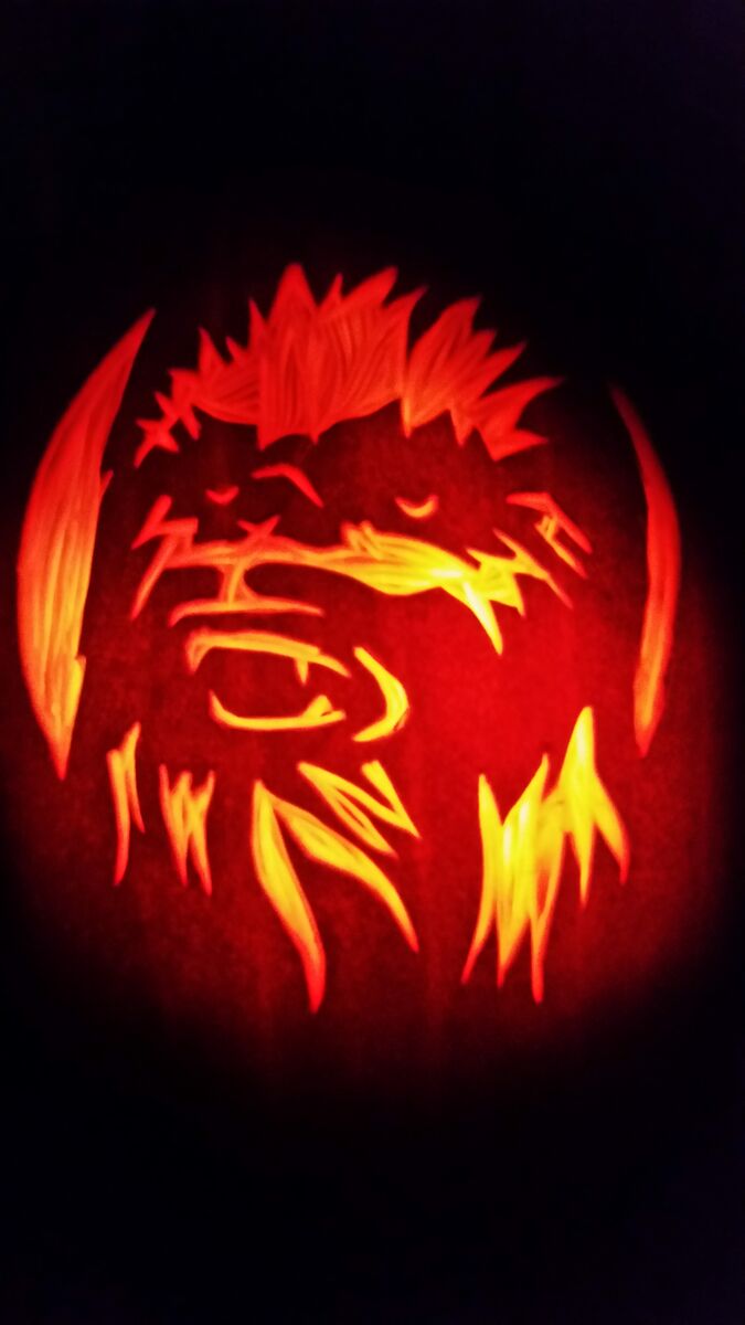 A pumpkin carved with Chewbacca from Star Wars.