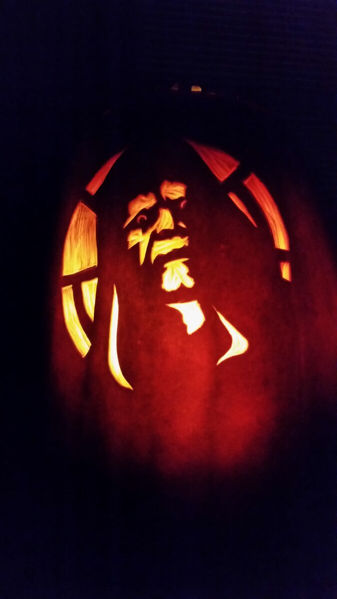 A pumpkin carved with Darth Sidious from Star Wars.