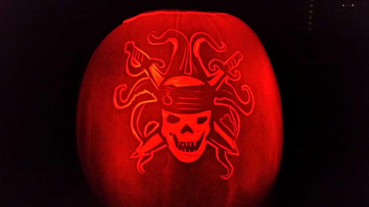 A pumpkin carved with a pirate skull wreathed in tentacles.