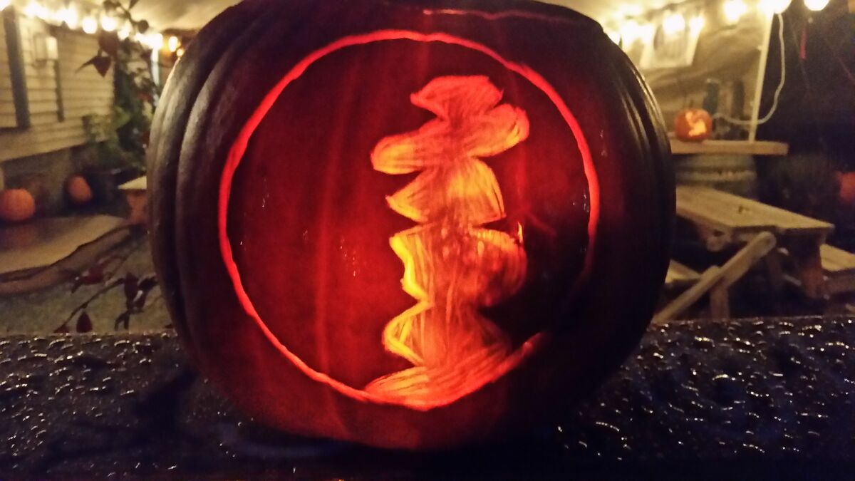 A pumpkin carved with the Stone's Throw Brewing logo.