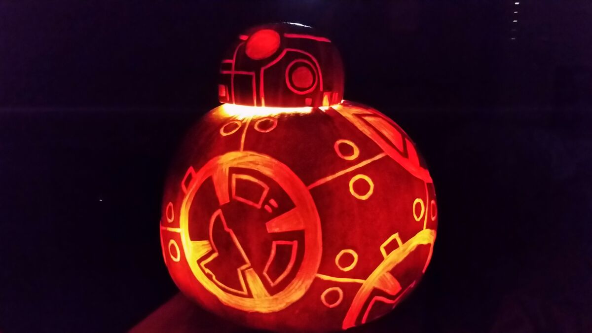 A pumpkin carved with BB-8 from Star Wars.