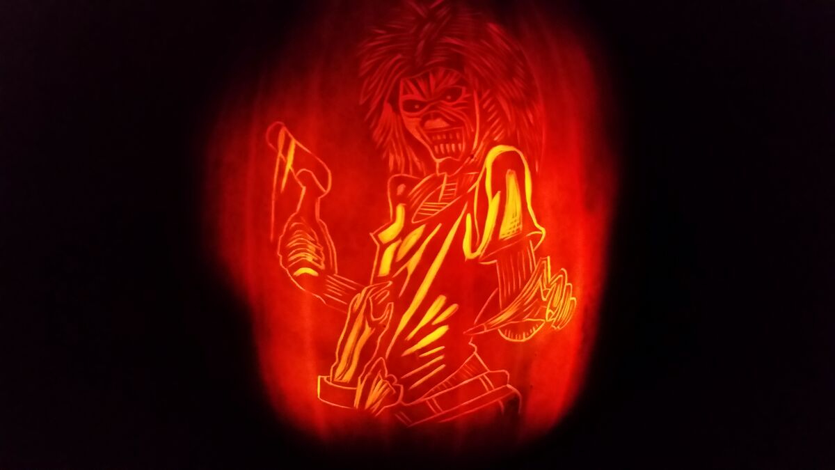 A pumpkin carved with Eddie from Iron Maiden, as he appears on the Killers album art.