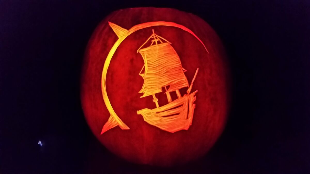 A pumpkin carved with the North Coast Growers logo.