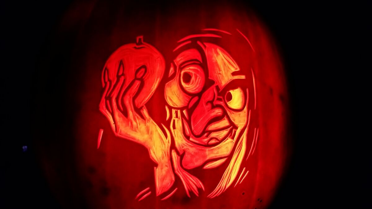 A pumpkin carved with the Evil Witch from Snow White and the Seven Dwarfs.
