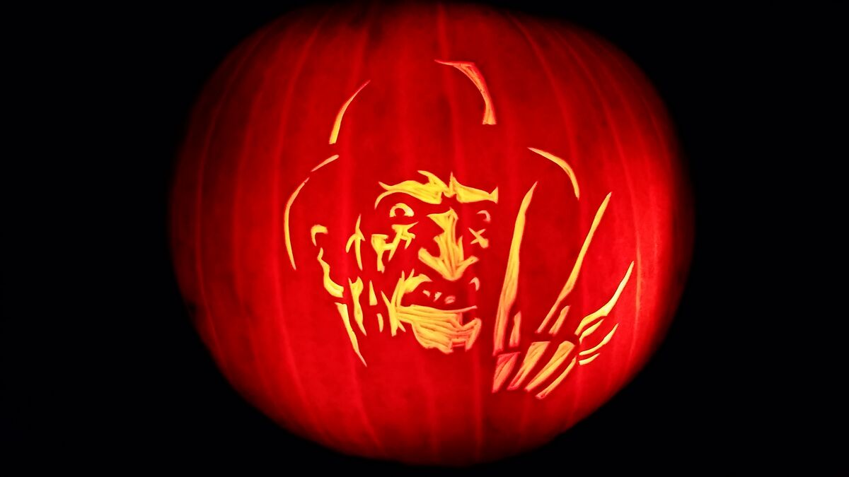 A pumpkin carved with Freddy Krueger from A Nightmare on Elm Street.