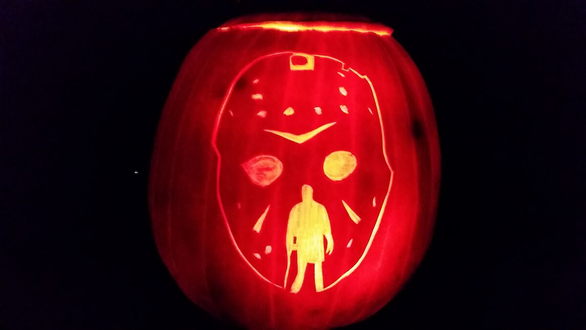A pumpkin carved with imagery from Friday the 13th.