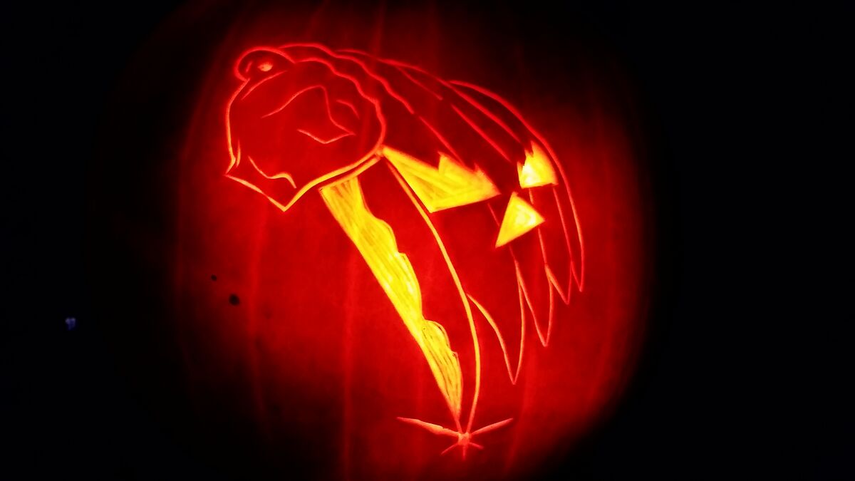 A pumpkin carved with imagery from Halloween (1978).