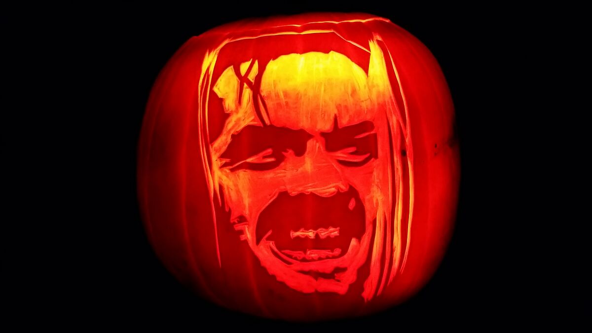 A pumpkin carved with the Heeeeere's Johnny! scene from The Shining.