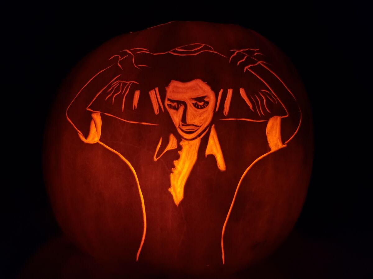 A pumpkin carved with Magenta from The Rocky Horror Picture Show.