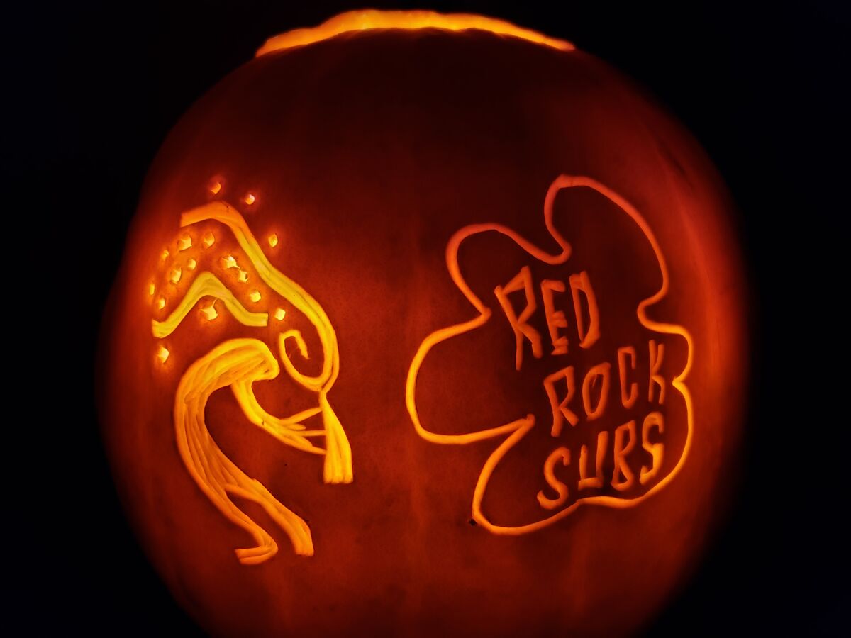 A pumpkin carved with the Red Rock Subs logo.