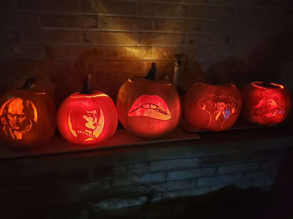 A group of pumpkins carved with characters from The Rocky Horror Picture Show.