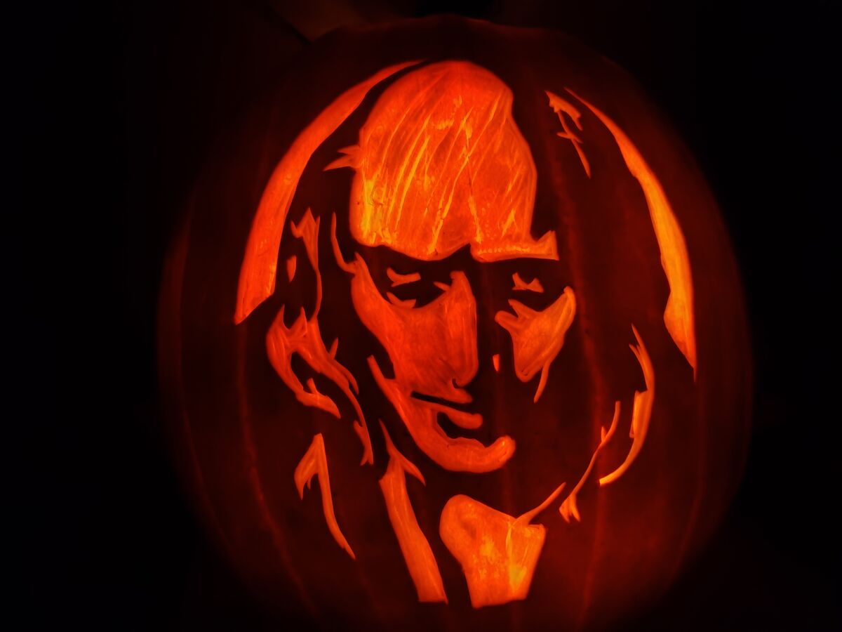 A pumpkin carved with Riff Raff from The Rocky Horror Picture Show.