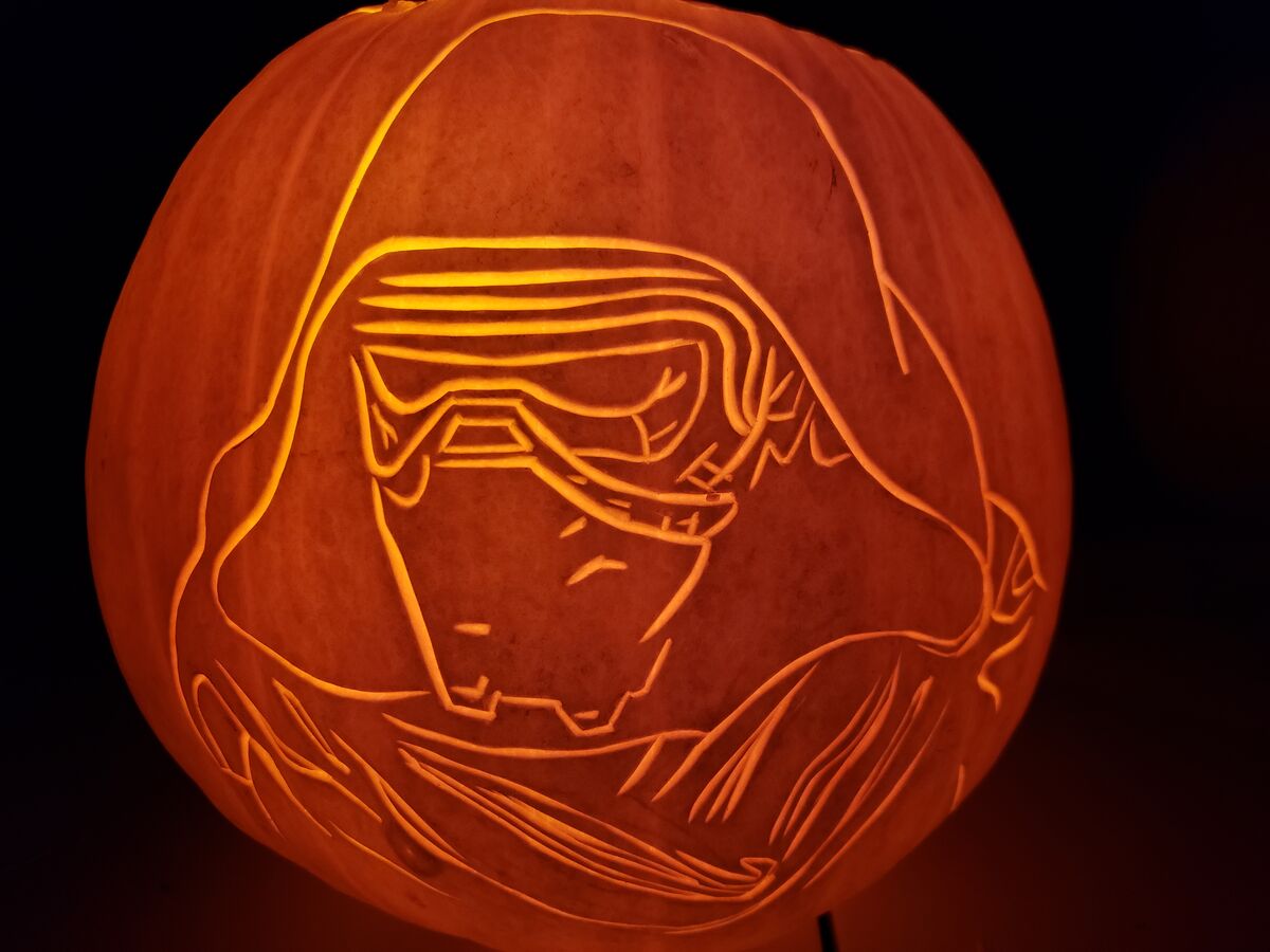 A pumpkin carved with Kylo Ren from Star Wars.
