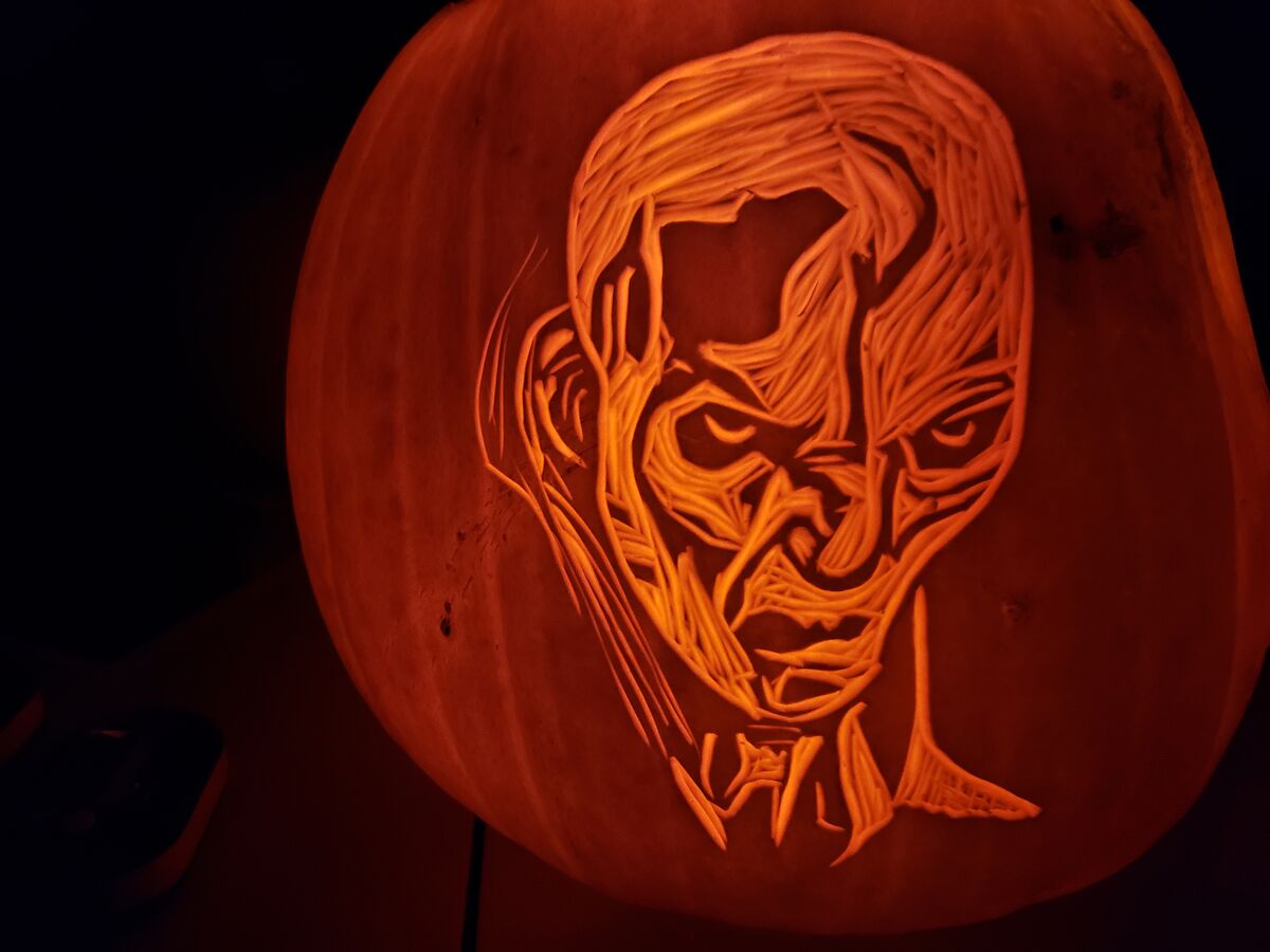 A pumpkin carved with Supreme Leader Snoke from Star Wars.