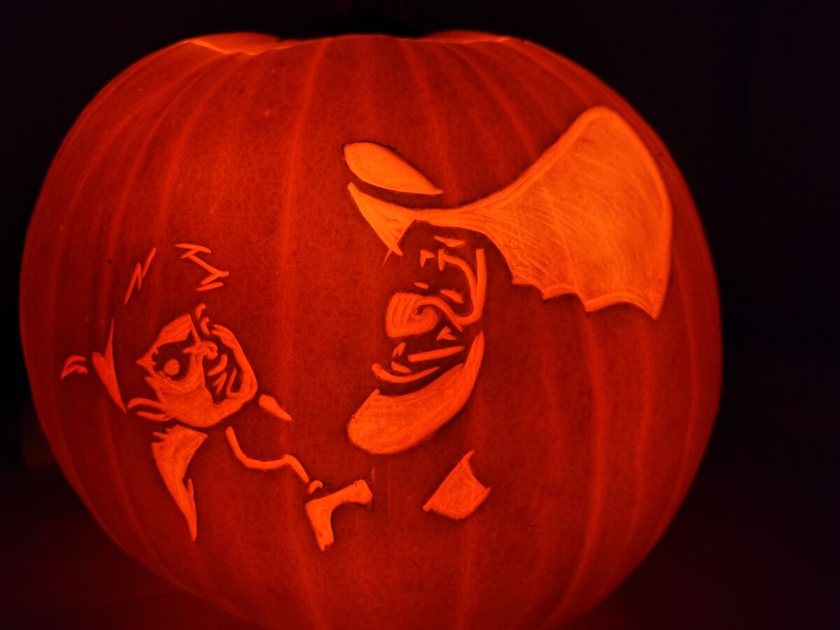 A pumpkin carved with Peter Pan and Captain Hook, from Peter Pan.