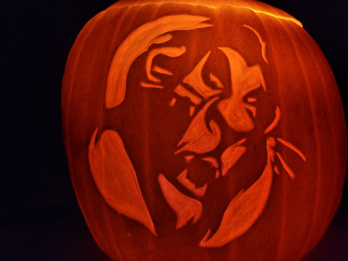 A pumpkin carved with Scar from The Lion King.