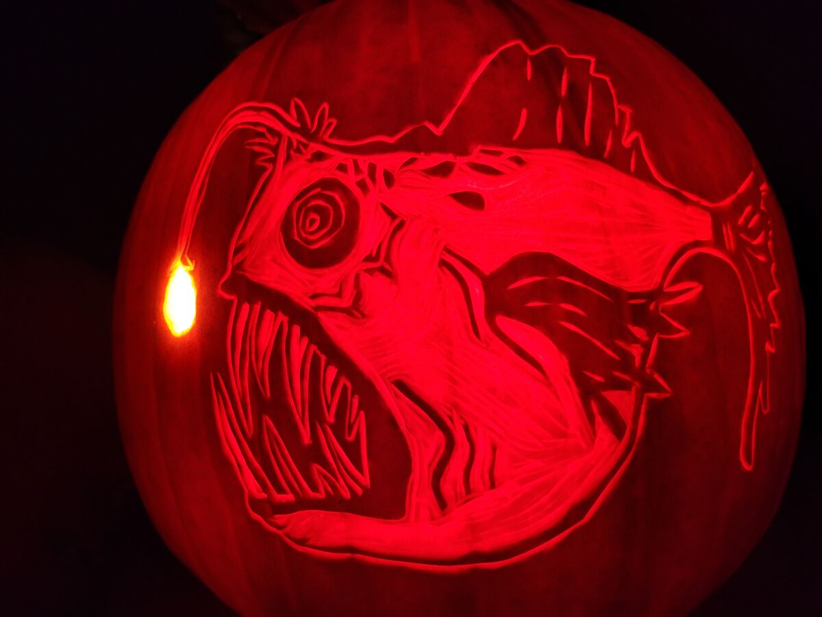 A pumpkin carved with imagery from 20,000 Leagues Under the Sea.