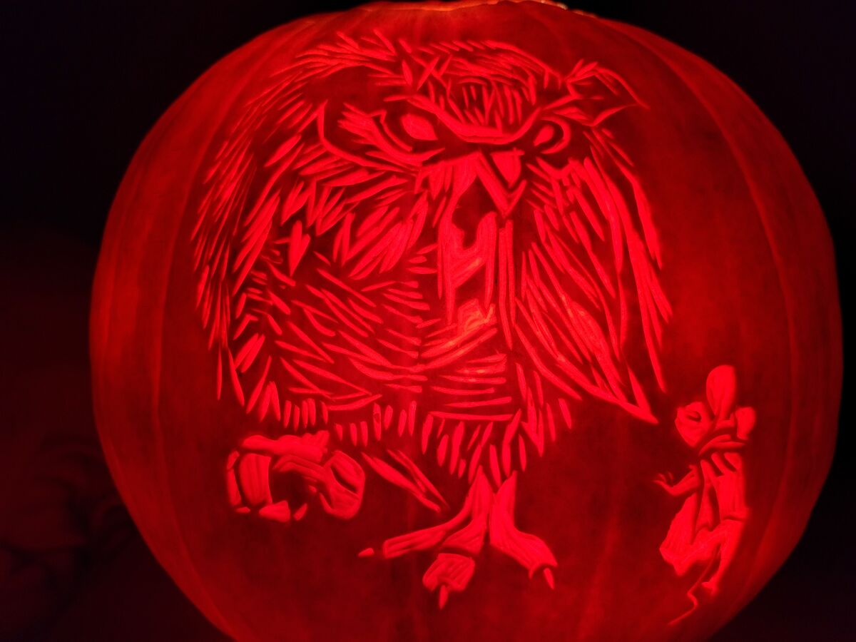 A pumpkin carved with imagery from Mrs. Frisby and the Rats of NIMH.