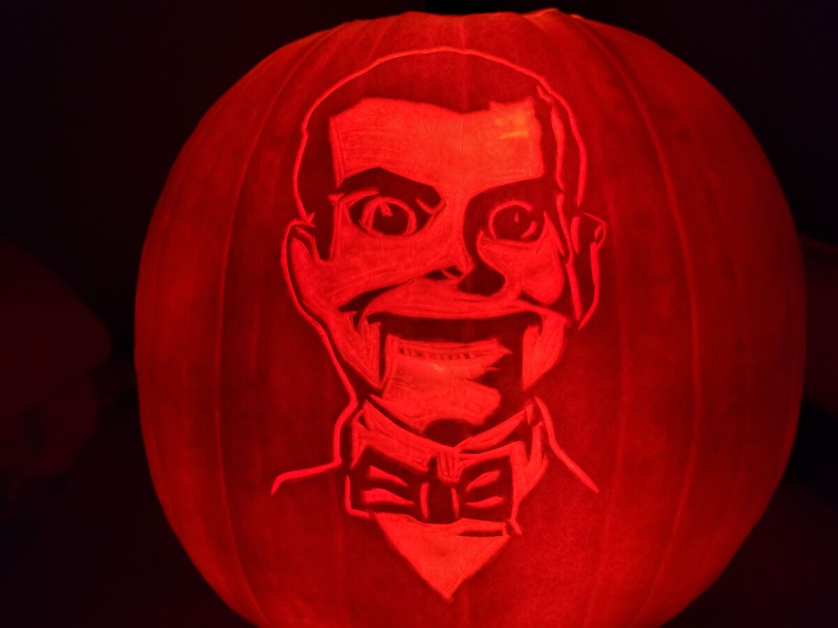 A pumpkin carved with Slappy the Dummy from Goosebumps.