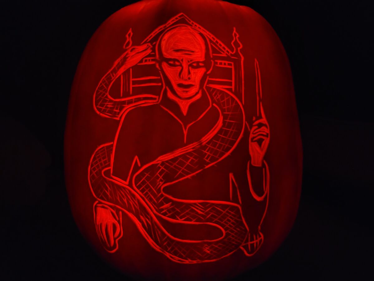 A pumpkin carved with Lord Voldemort from Harry Potter.
