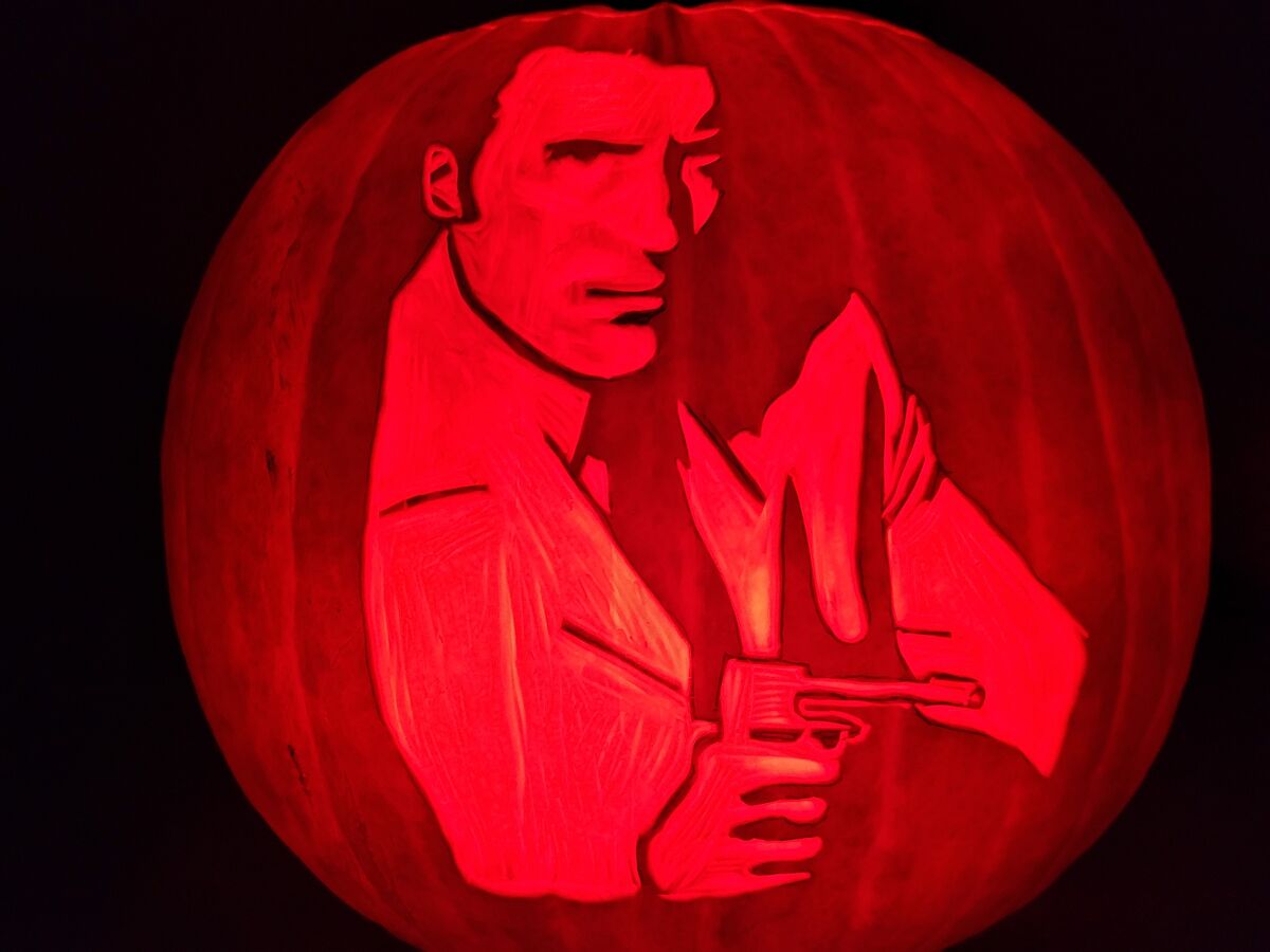 A pumpkin carved with Francisco Scaramanga from The Man with the Golden Gun.