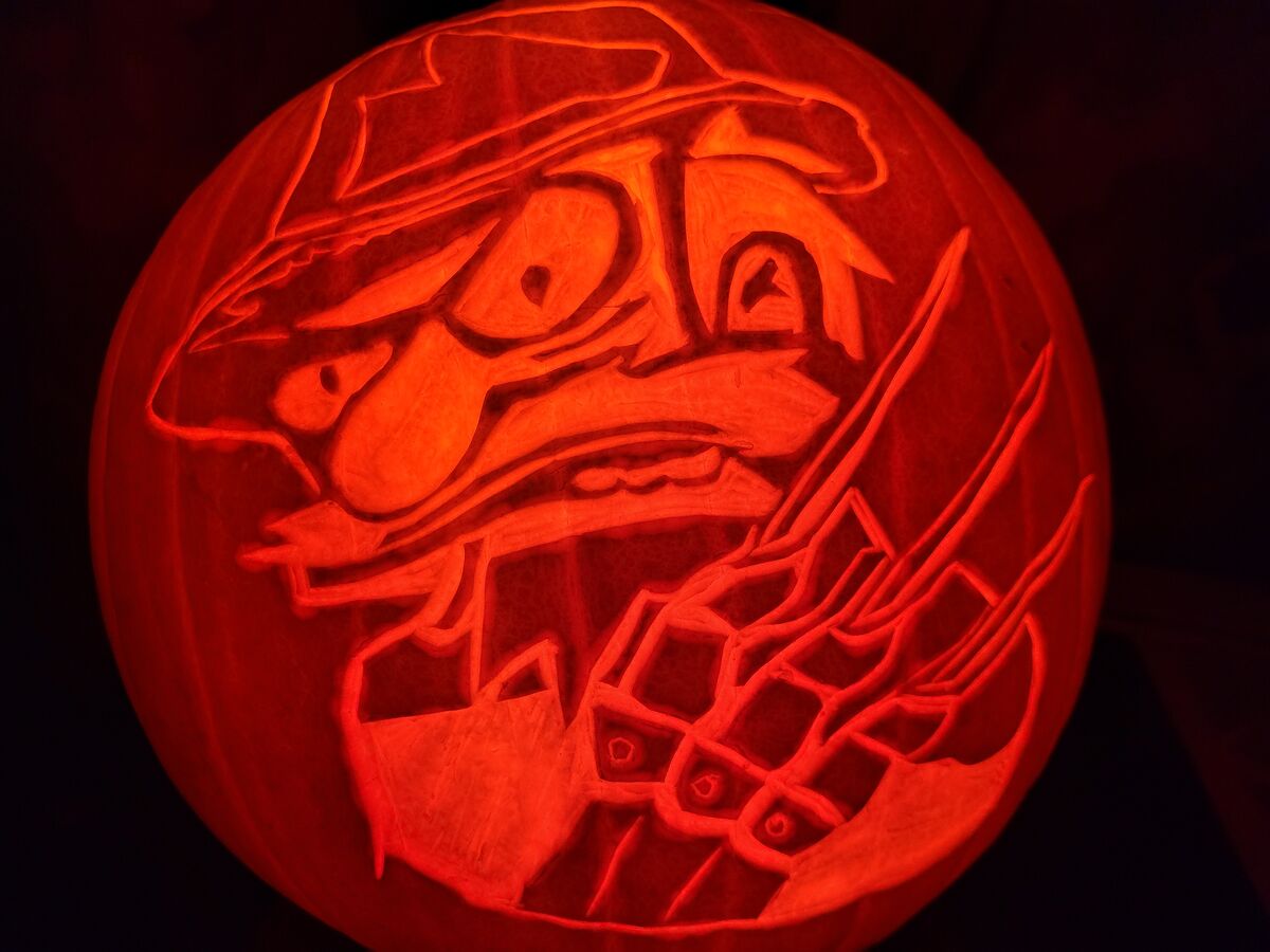 A pumpkin carved with Groundskeeper Willie from The Simpsons.