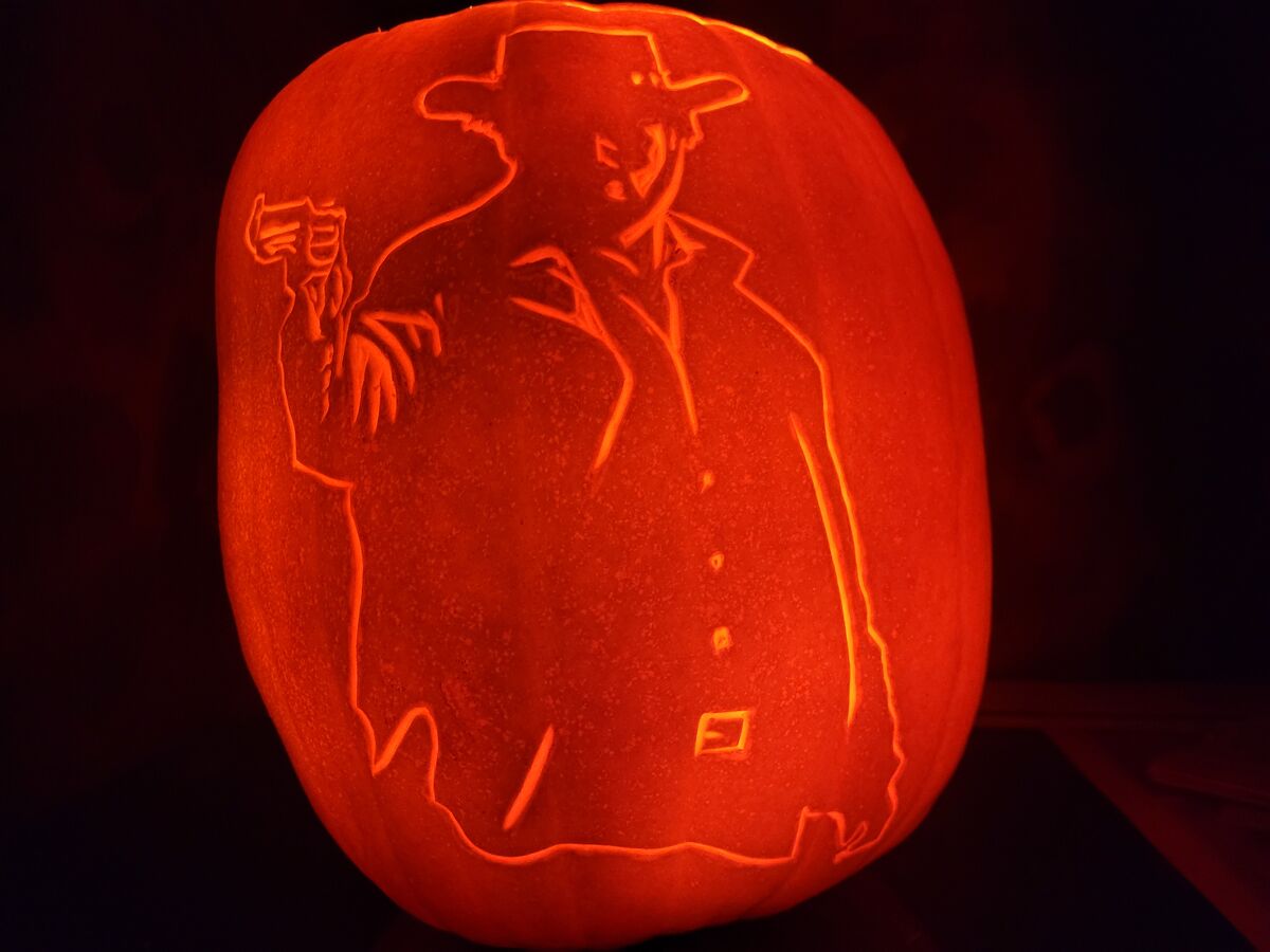 A pumpkin carved with a gunslinger.