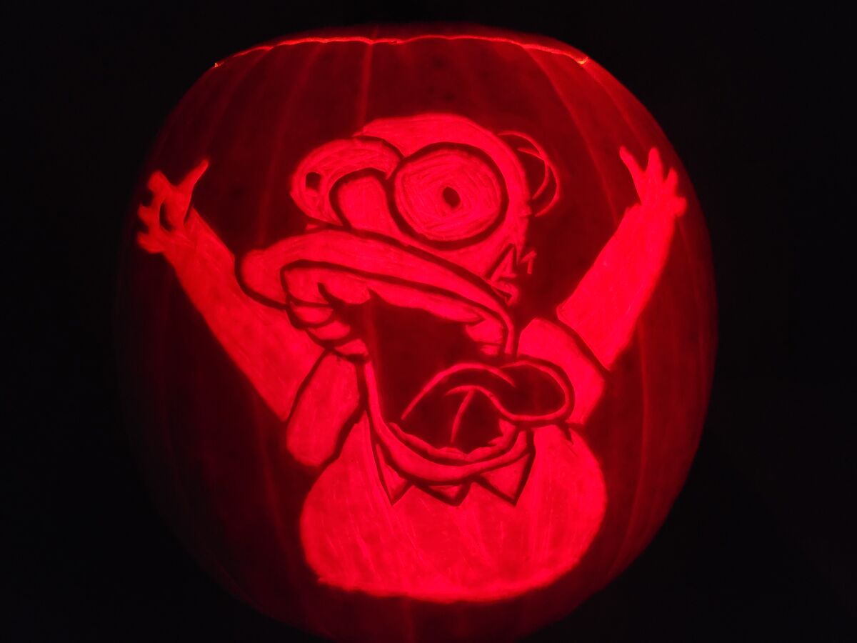 A pumpkin carved with Homer Simpson from The Simpsons.