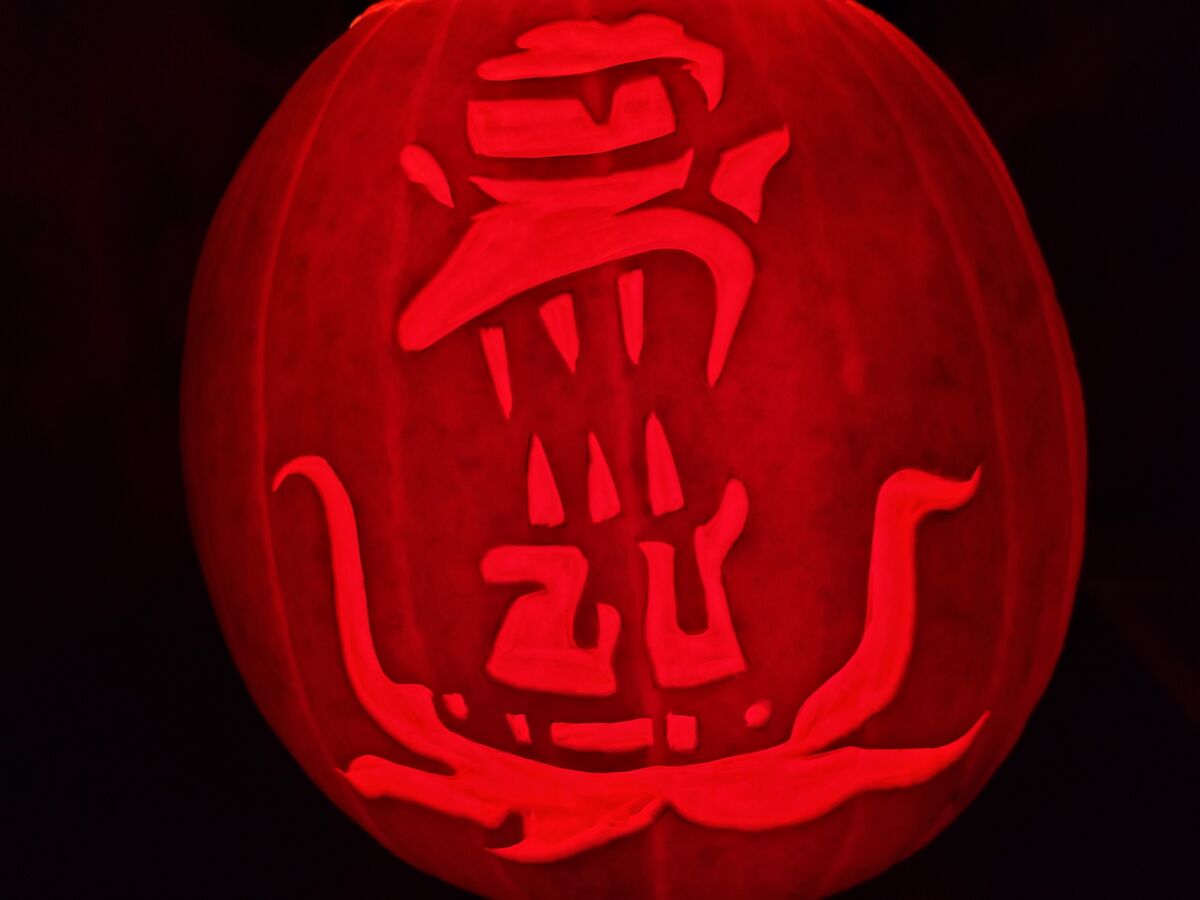 A pumpkin carved with Kang from The Simpsons.