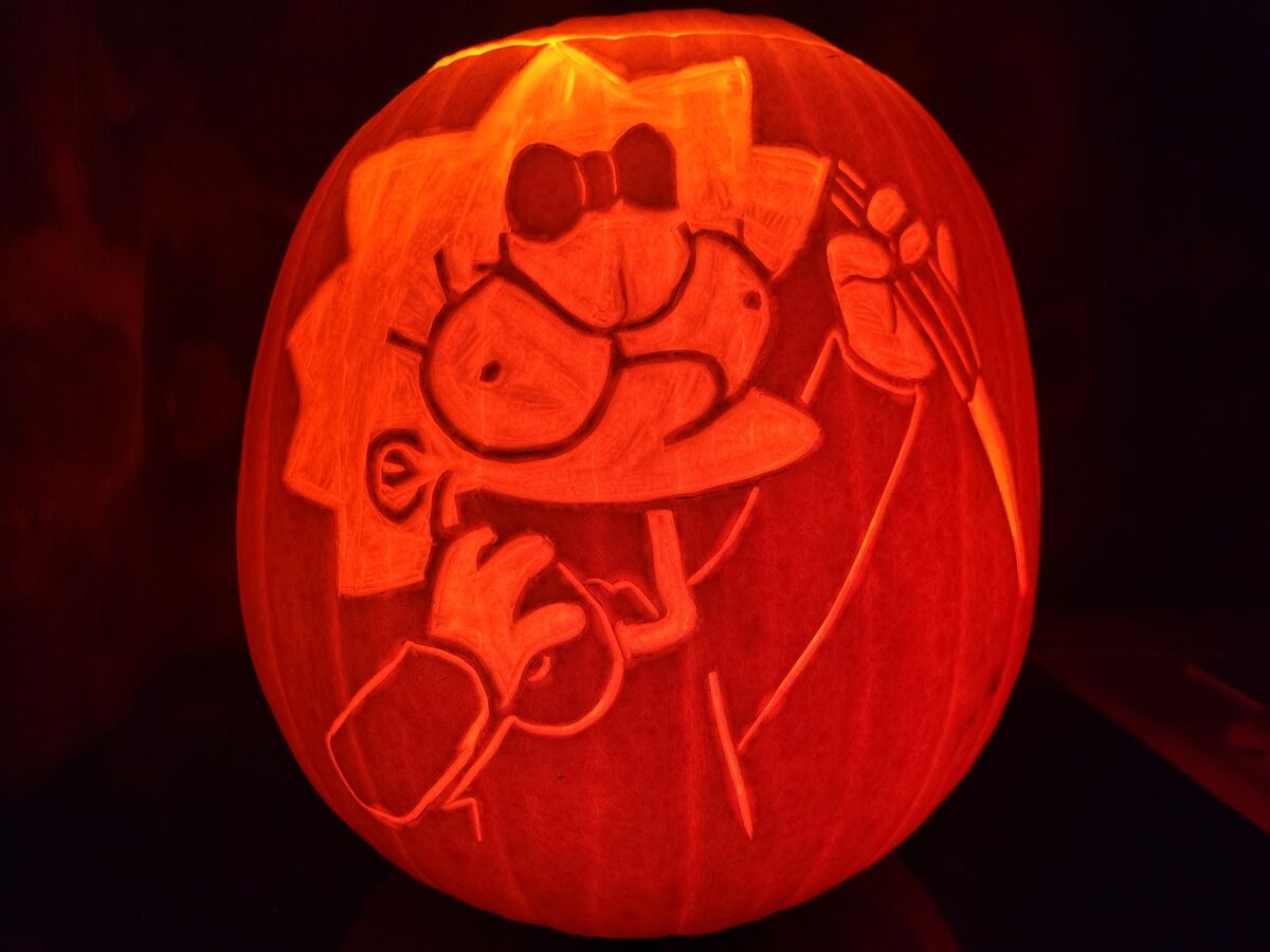 A pumpkin carved with Maggie Simpson from The Simpsons.