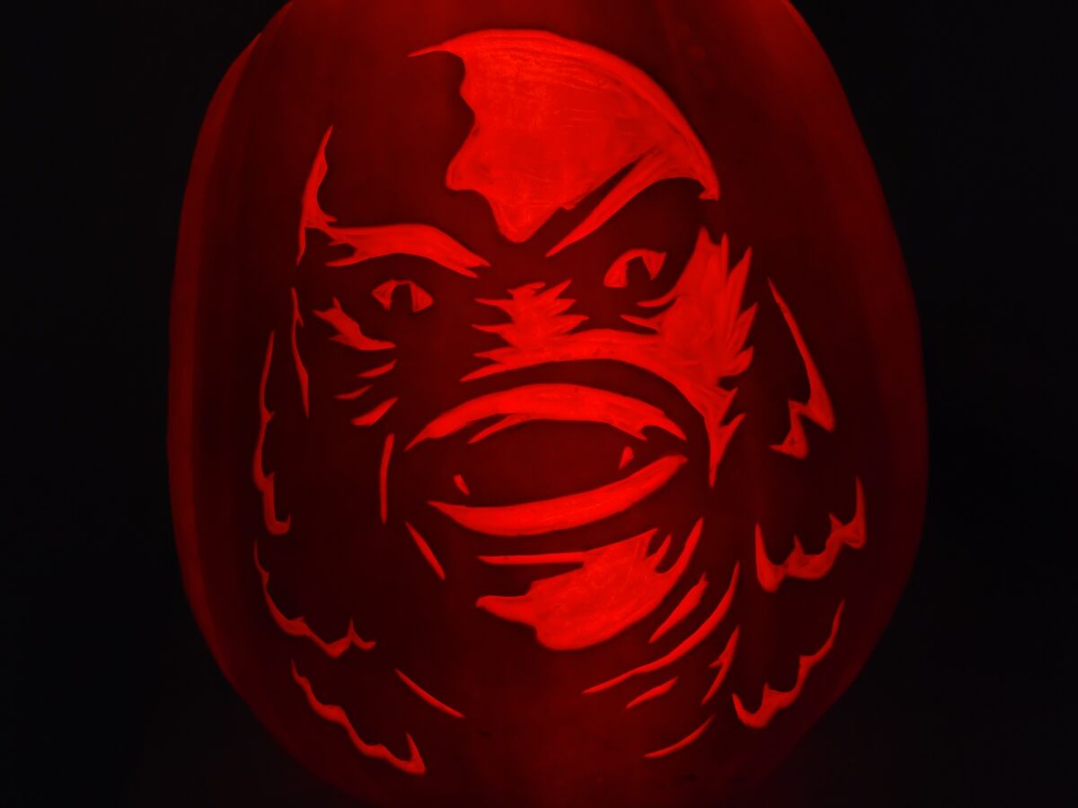 A pumpkin carved with the Creature from the Black Lagoon.
