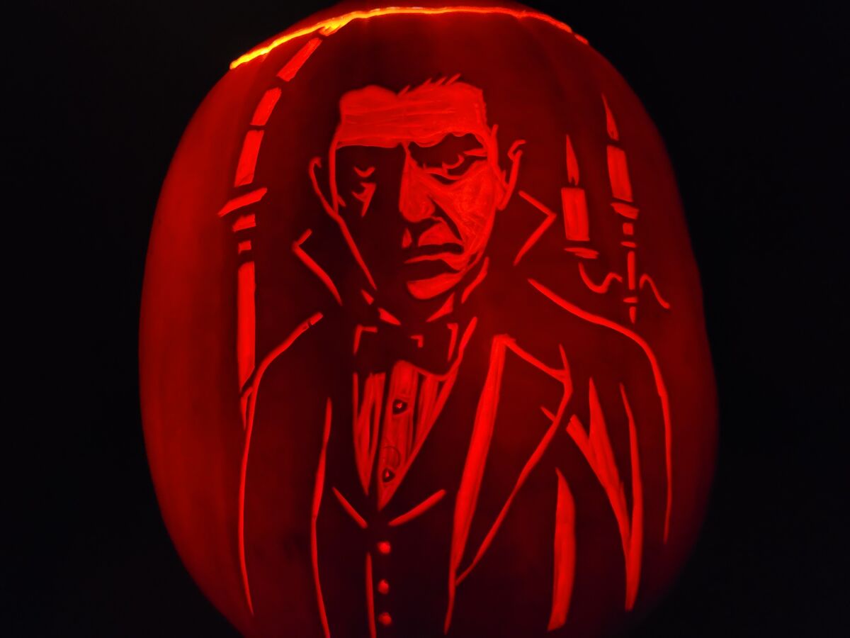 A pumpkin carved with Dracula.