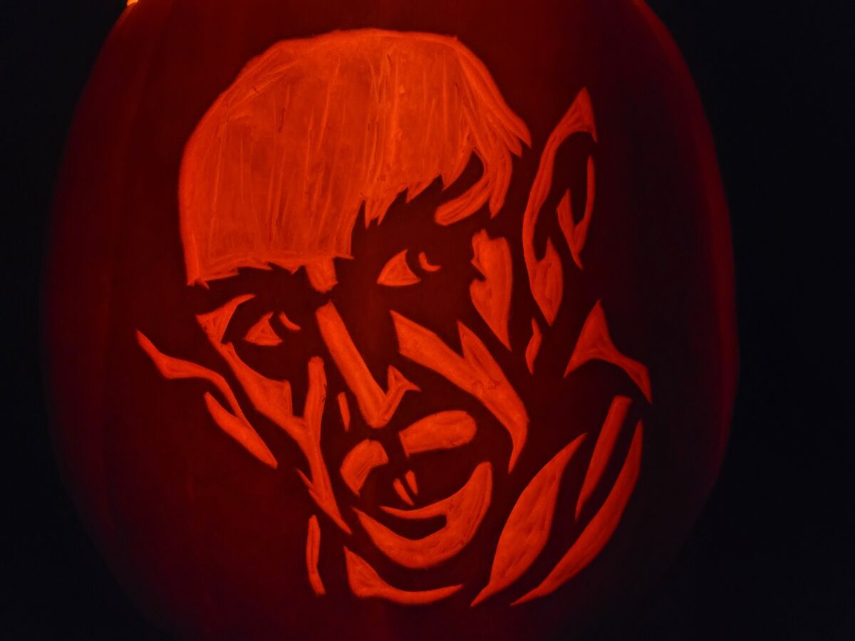 A pumpkin carved with Nosferatu.