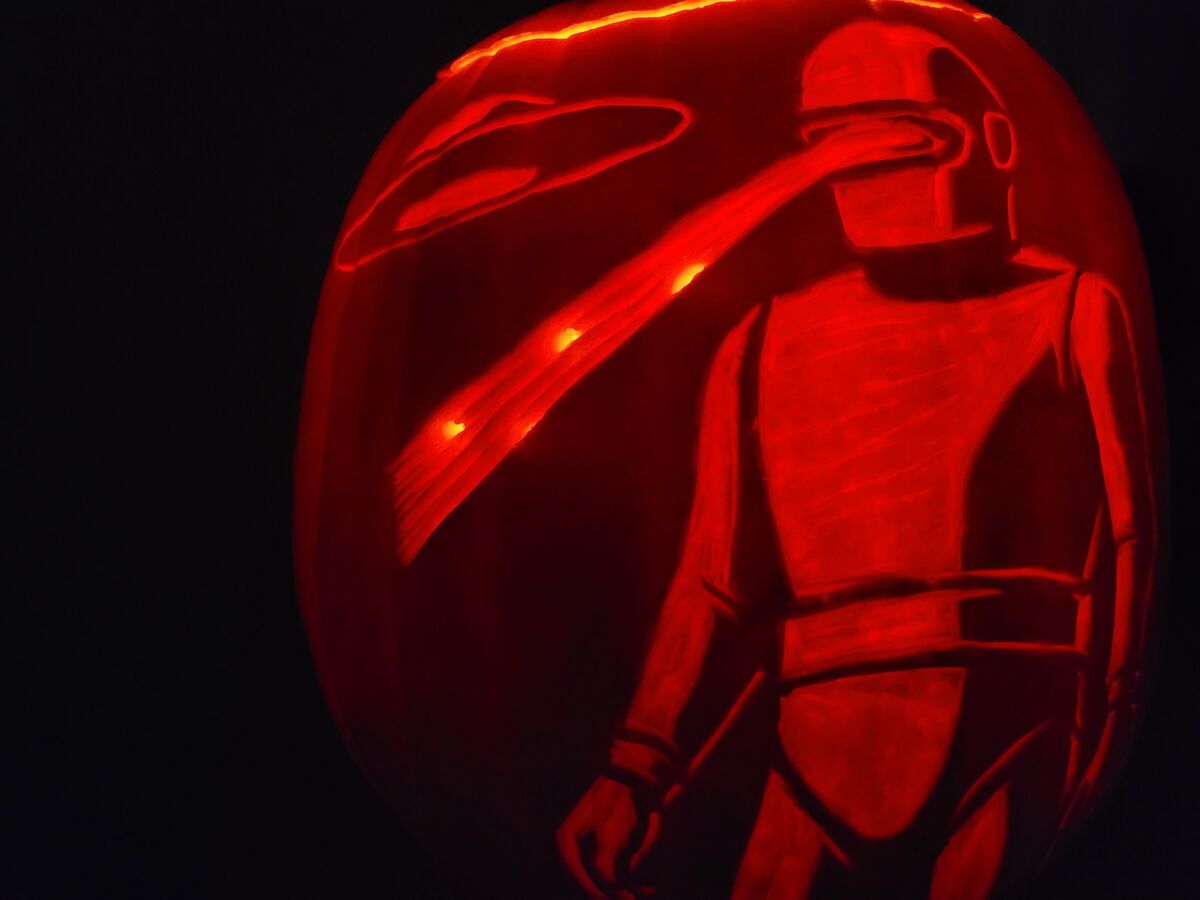 A pumpkin carved with Klaatu from The Day the Earth Stood Still.